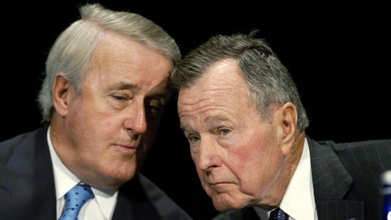 Former U.S. President George H.W. Bush, right, and former Canadian Prime Minister Brian Mulroney, left, gather for a conference on NAFTA at the Woodrow Wilson International Center for Scholars in Washington, Monday, Dec. 9, 2002. THE CANADIAN PRESS/AP-J. Scott Applewhite