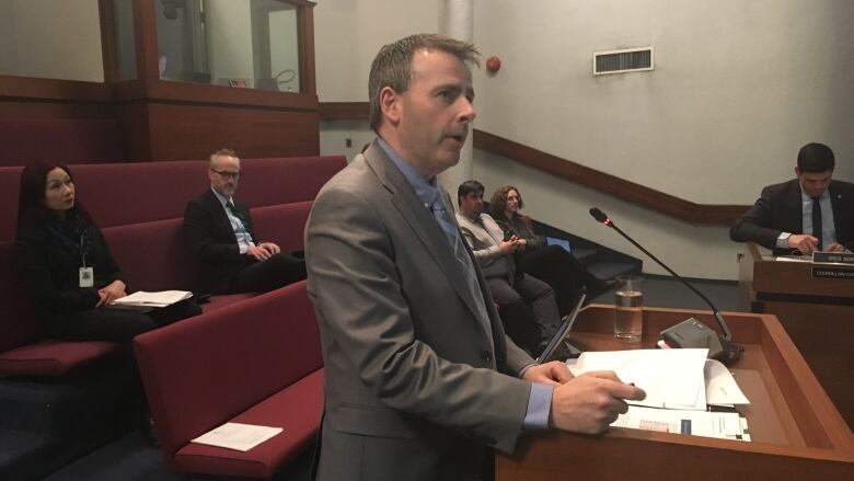 Kevin Fudge stands at the podium at Saint John city council