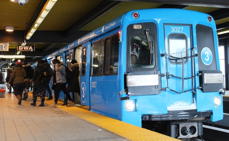 Blue light-rail train car.