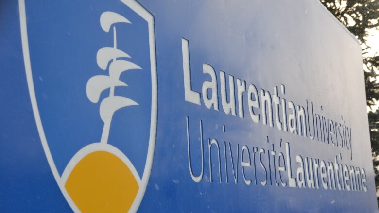 A blue sign reads 'Laurentian University'