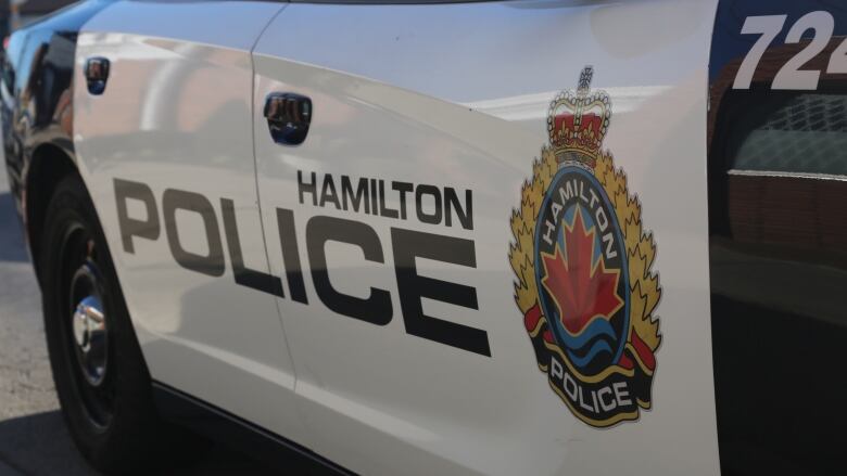 A police car with the Hamilton police logo.