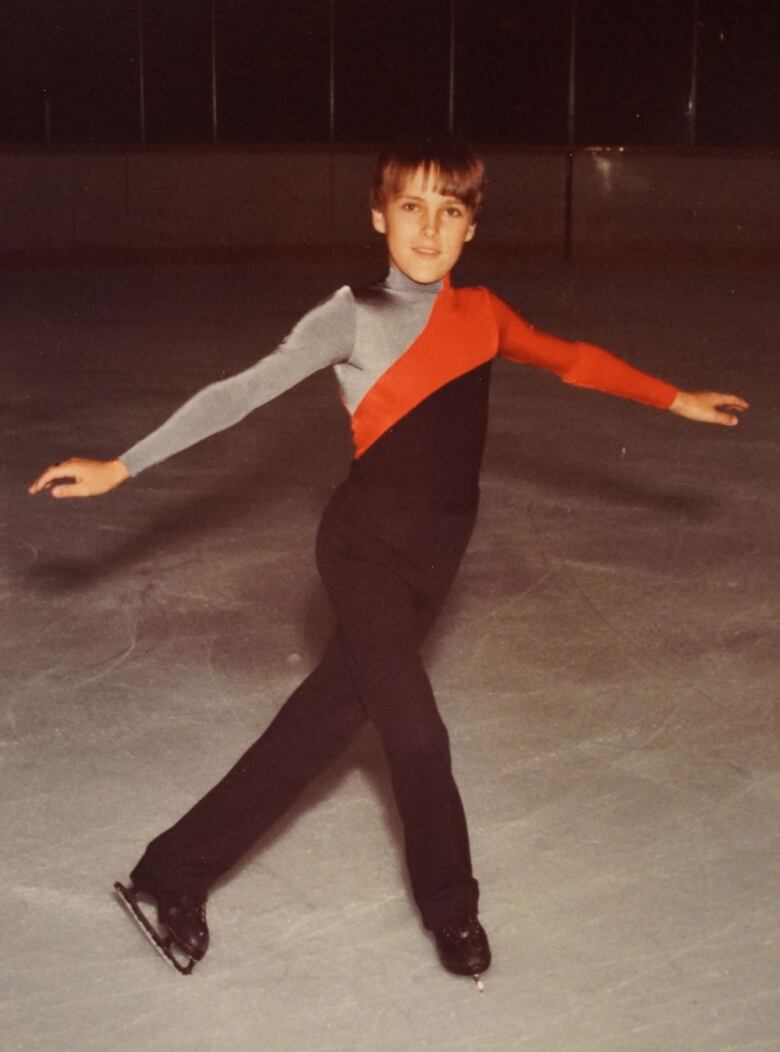 Young boy in black jumper and skates