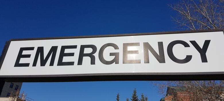 A close-up of a sign that says Emergency