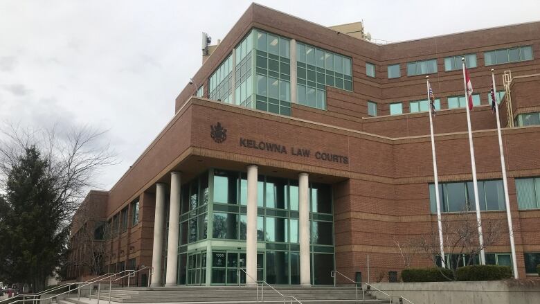 A photo of the Kelowna courthouse and courthouse steps