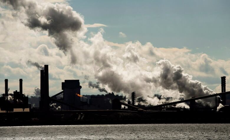 Power plant with lots of smoke arising from it