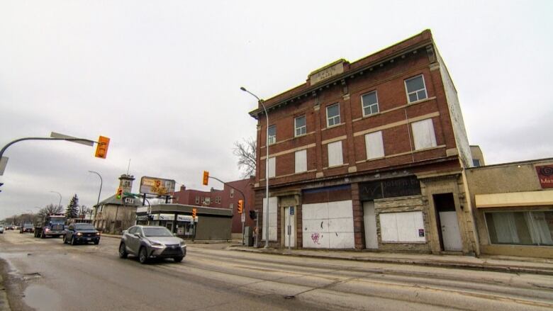 A boarded up apartment building.