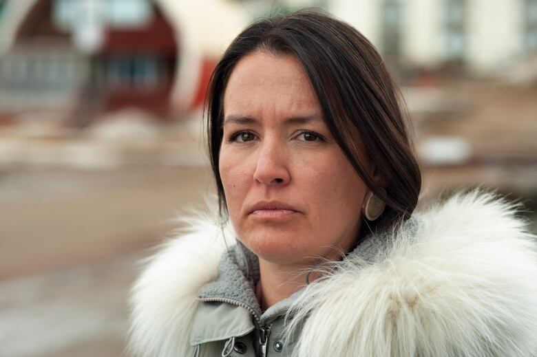 A woman poses for a headshot.