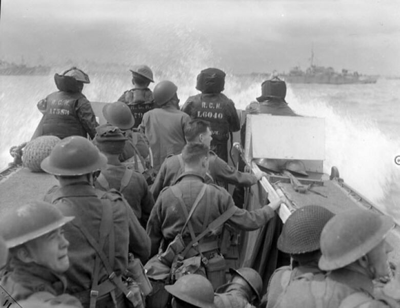 Soldiers on a boat, seen from behind