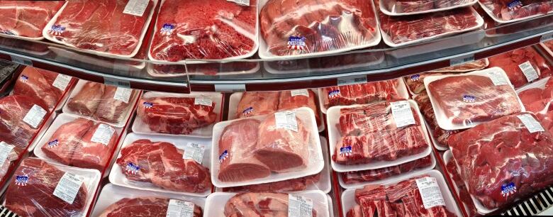 FILE - In this Nov. 2, 2013 file photo, various cuts of beef and port are displayed for sale in the meat department at a discount market in Arlington, Va.  Cattle groups from the U.S. and Canada are upset that a new Farm Bill passed by the House on Wednesday, Jan. 29, 2014, fails to make changes to country-of-origin labeling requirements. The rules require detailed labels about the origins of beef, pork and chicken sold in U.S. stores.