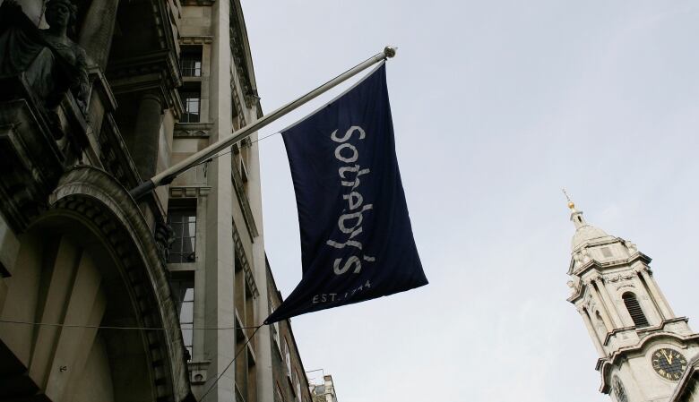 Sotheby's flag mounted off building.