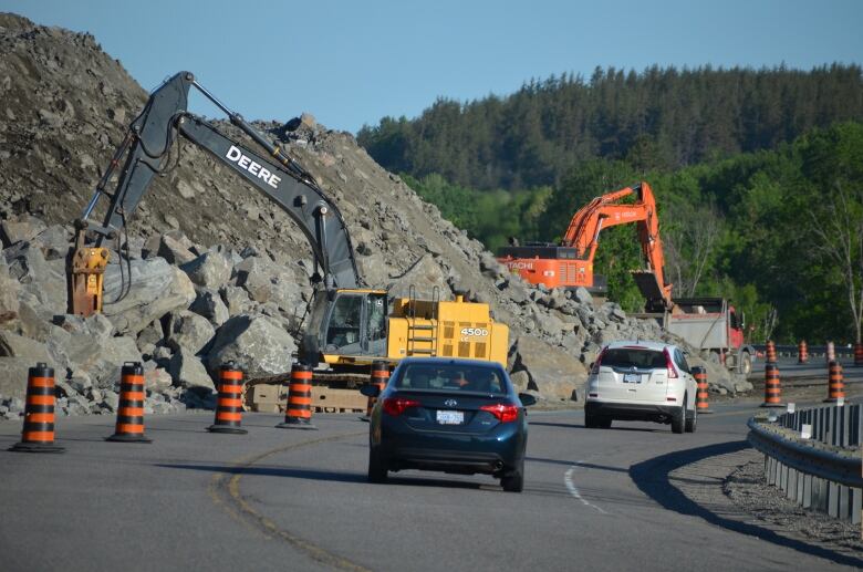 Construction happening on a highway.