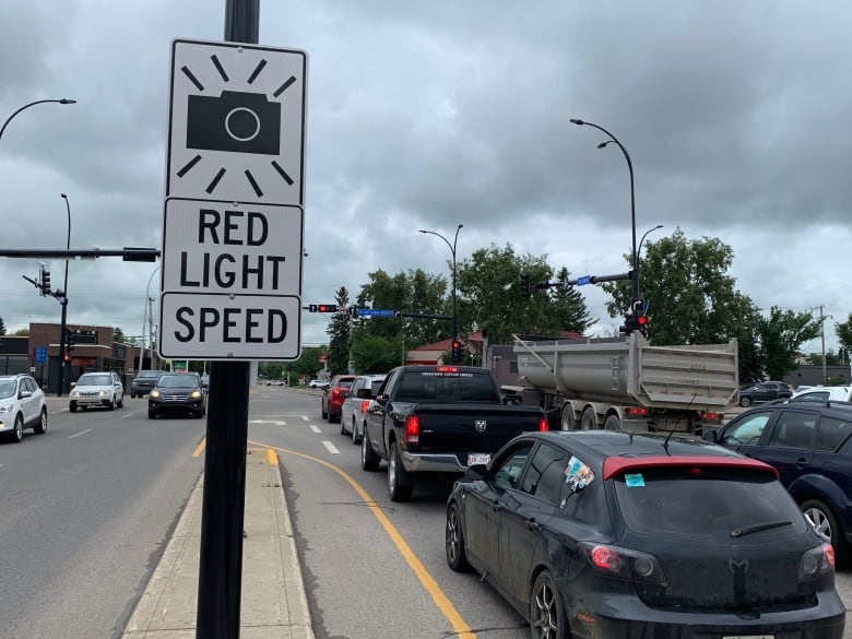 A sign marks that a red-light camera is ahead. 