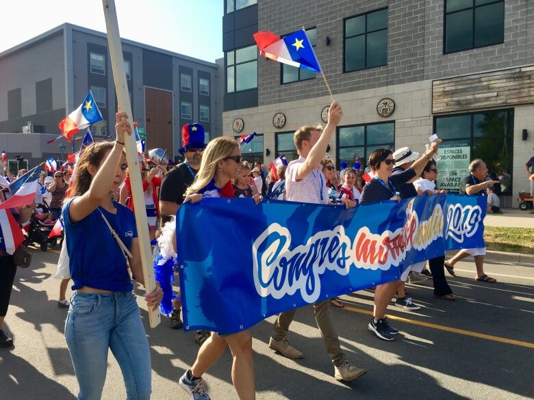 People take part in a parade.