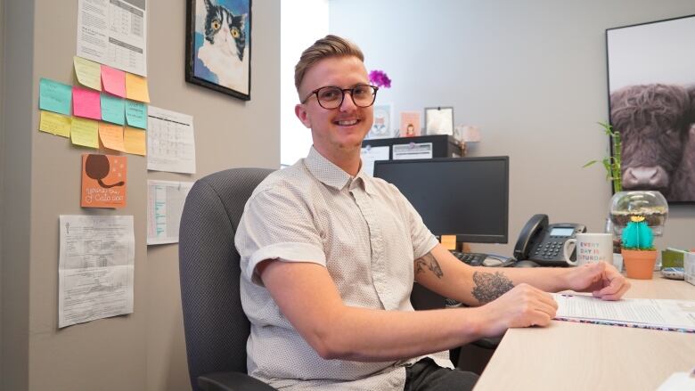 A person sitting at their desk.