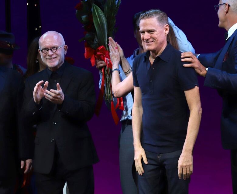 Jim Vallance, left, and Bryan Adams participate in the 