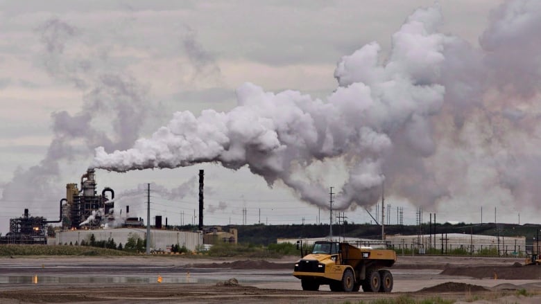 A dump truck works near the Syncrude oil sands