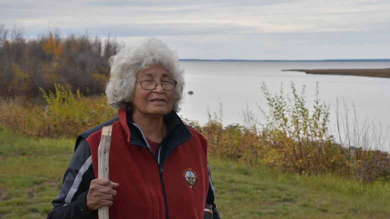 Elder Margaret Leishman on the shore of the Mackenzie River in Kakisa, N.W.T. 