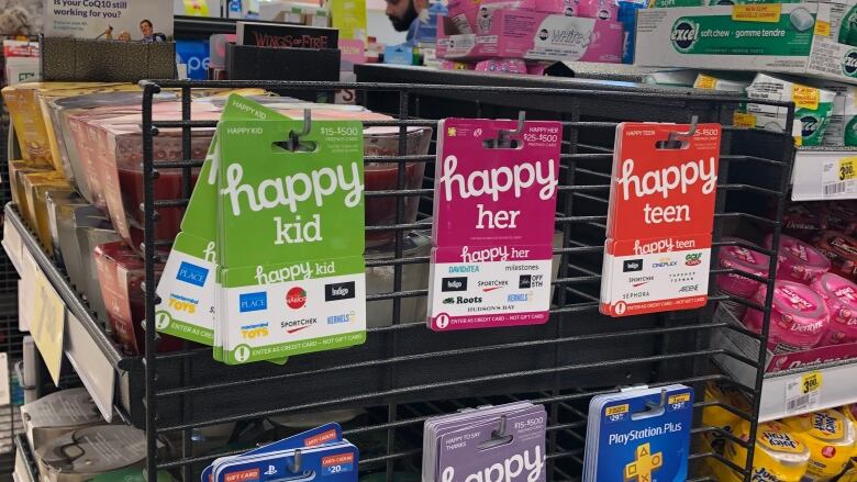 Gift cards on a rack.