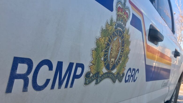 Car with RCMP logo on the side. 