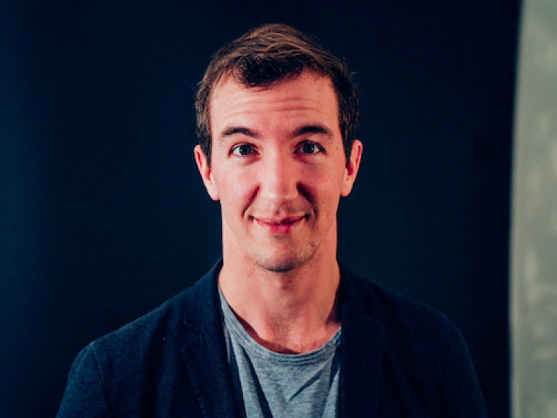 A headshot of a man posing for a picture. 