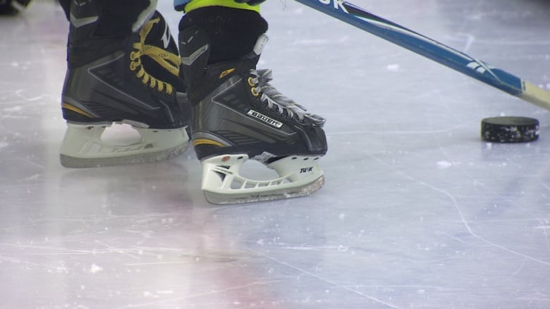 A close-up of hockey skates.