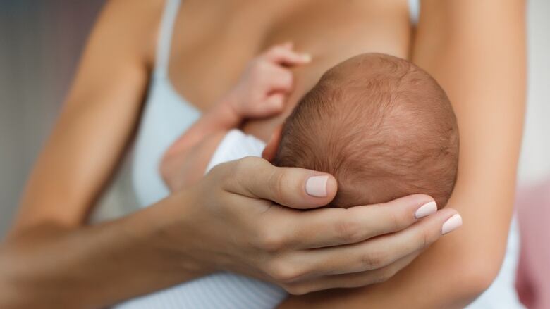 Mother breastfeeding her child.