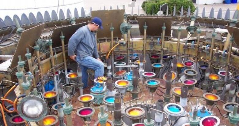 A worker in the interior of a large fountain