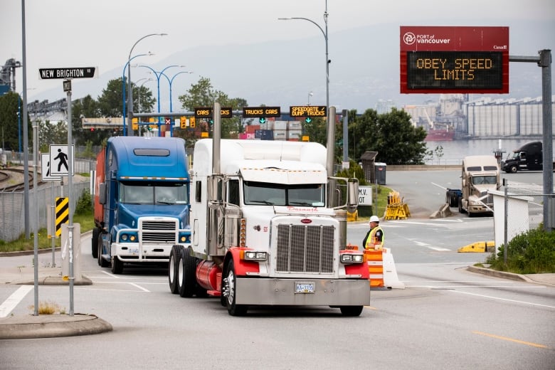 Container transport trucks at entrance of  Port Metros Port of Vancouver in Vancouver, British Columbia on Wednesday, May 29, 2019. 