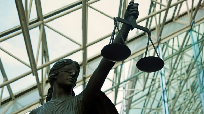 The statue of Themis, Goddess of Justice in the atrium of the Supreme Court. It is a blind goddess holding a scale.