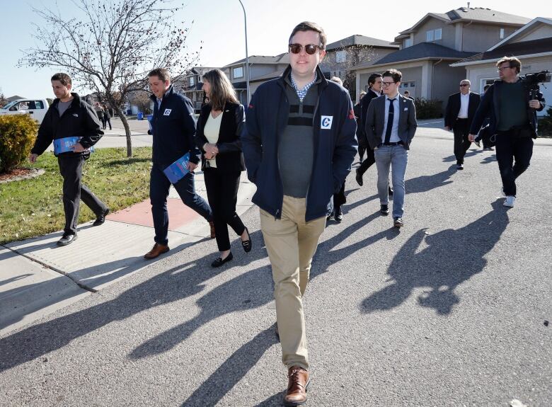 Conservative campaign manager Hamish Marshall, centre, campaigns with Andrew Scheer, second from left, in Regina, Sask., Oct. 21, 2019.