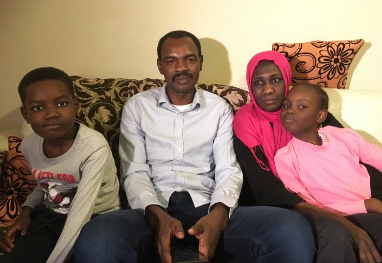 Ismail with his wife, Mona Tahir, and children, 10-year-old Loui and seven-year-old Lojiean, in their Charlottetown apartment