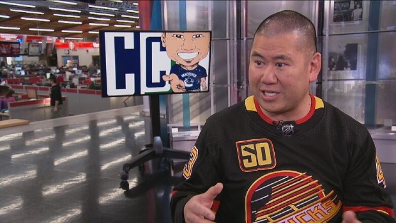 Photo of Vancouver Canucks 'superfan' Clay Imoo.