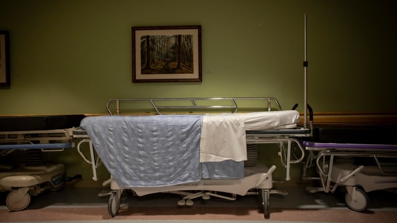 A hospital stretcher in the hallway.