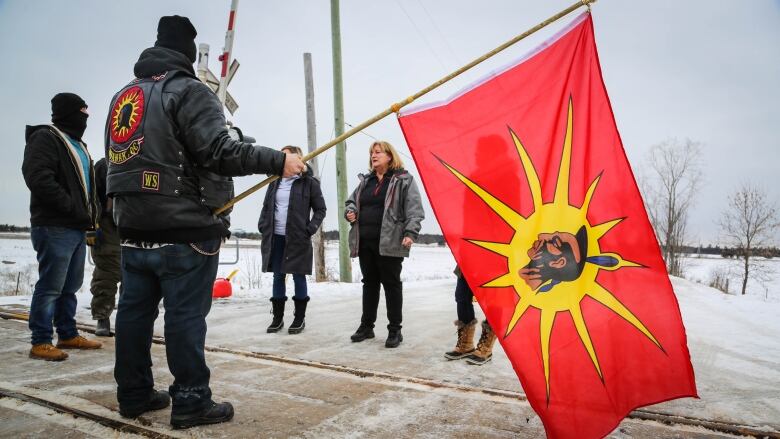 person holding a warrior flag