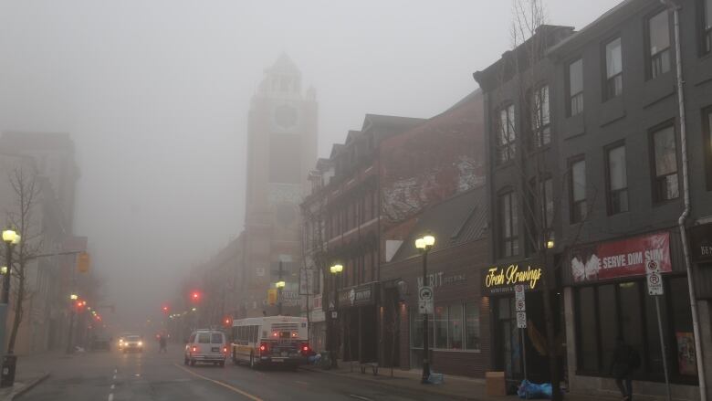 Buildings covered in fog.