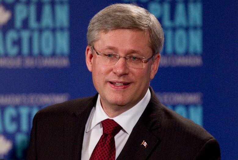 Prime Minister Stephen Harper reacts to a journalist's question during a press conference in which he announced an extension to the deadline for the Economic Action Plan in Mississauga, Ont., Dec. 2, 2010.