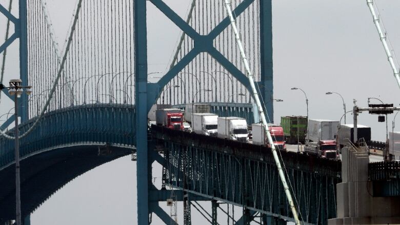 trucks crossing a bridge