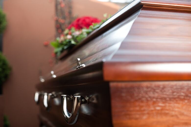 The side view of a funeral casket.