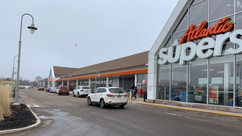 Cars line up to pick up online orders at the Atlantic Superstore in Charlottetown on Wednesday. 