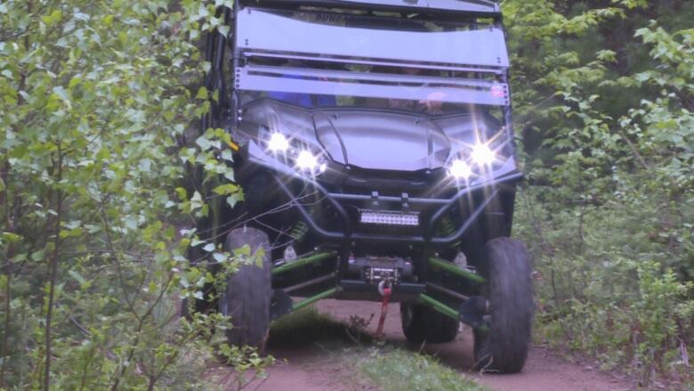 ATV driving in wooded area