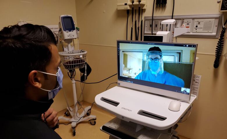 A virtual COVID-19 assessment over a computer.