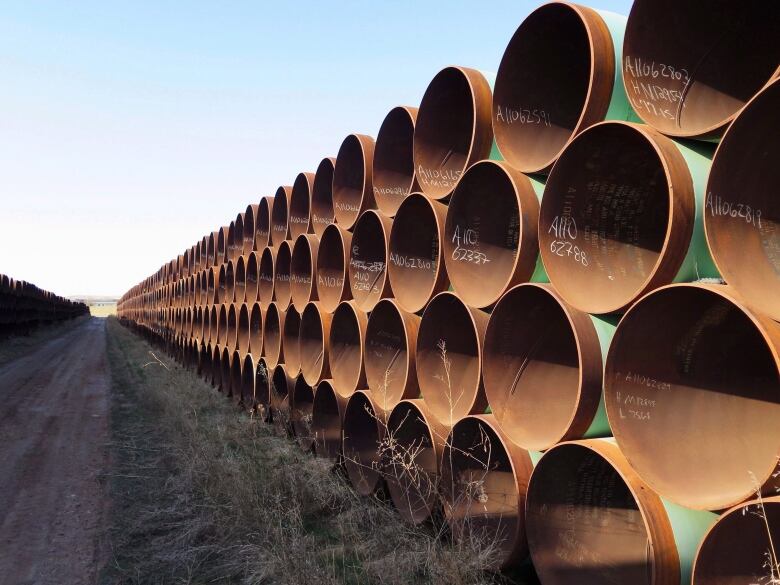 A stack of pipes is pictured.