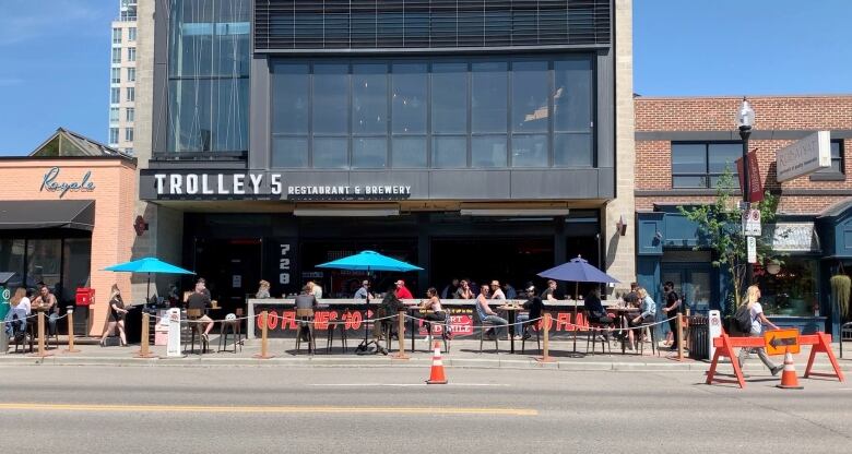 A patio is blocked off with cones. 