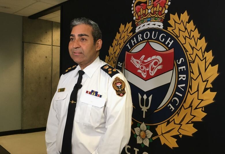 a man standing in front of police seal