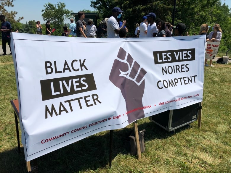 A BLM Sudbury banner on a sunny day.