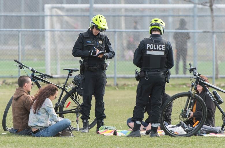 Two Montreal police officers patrol in a park in Montreal 