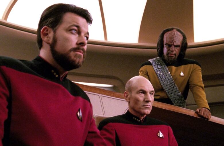 Star Trek actors look concerned.