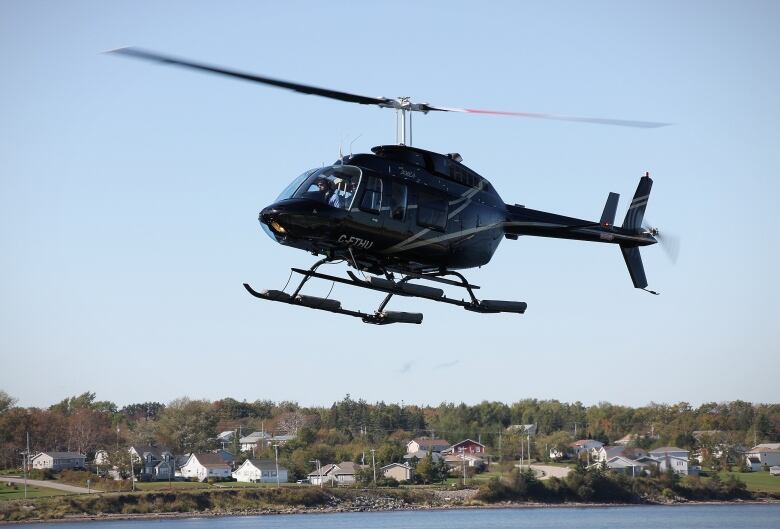 A helicopter is shown in the air.