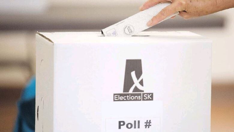 A Saskatchewan voter casts their ballot.