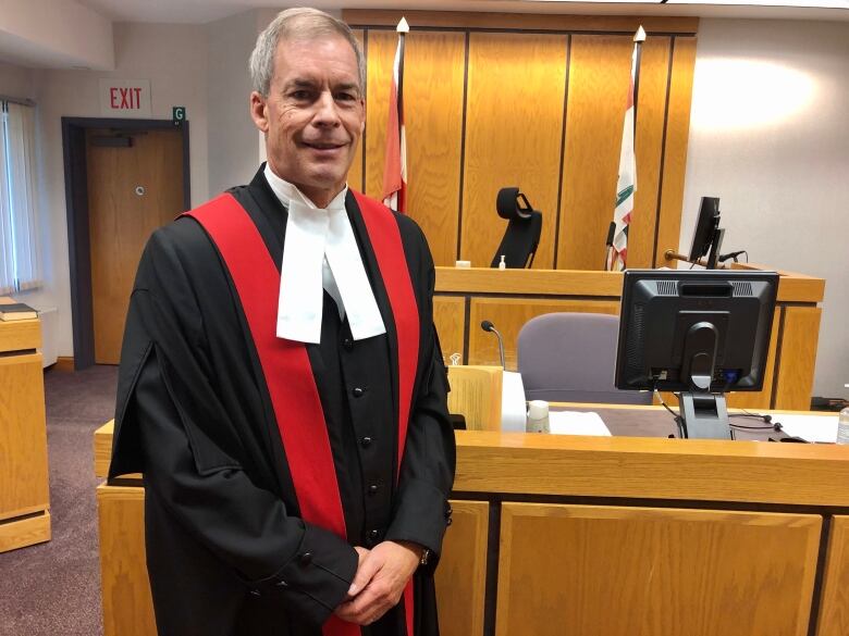 Chief Porvincial Court Judge Jeff Lantz stands in a courtroom.